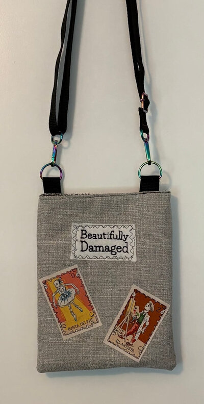 Beautifully Damaged crossbody bag with tarot card patches