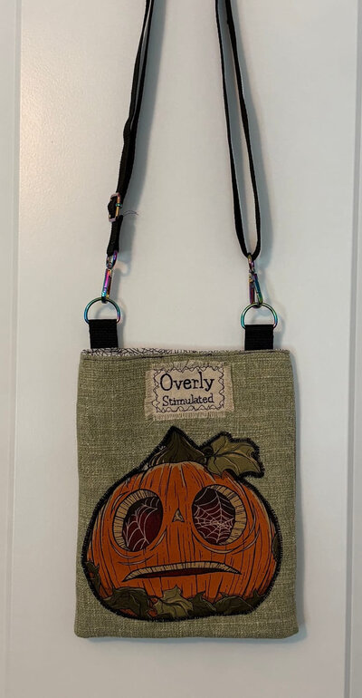 Overly Stimulated crossbody bag with pumpkin applique
